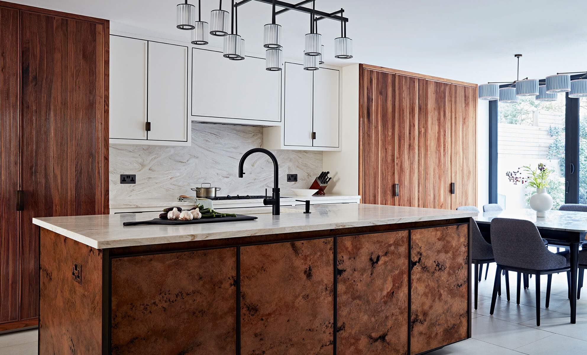 Beautiful wood and white marble kitchen in family home.