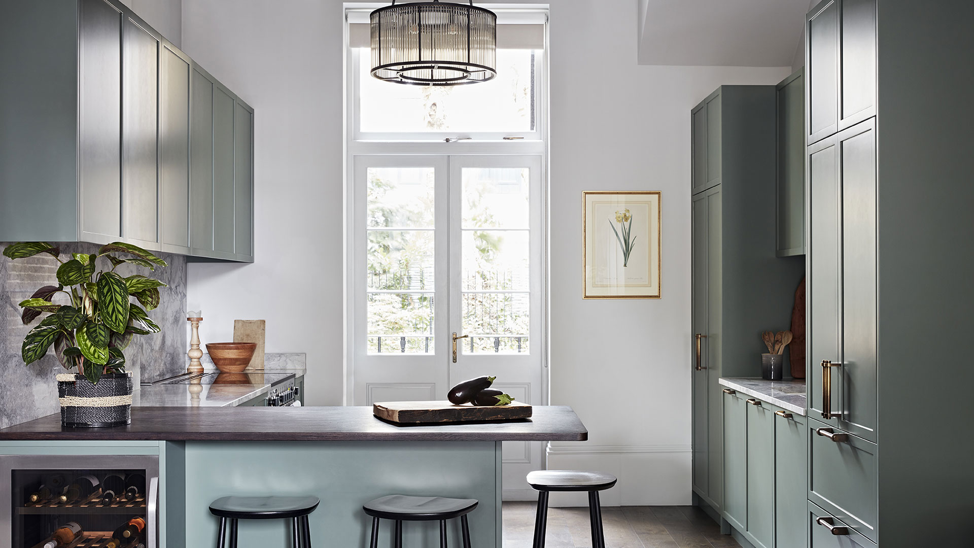 Bespoke kitchen design by Godrich Interiors in hues of grey and duck egg green.