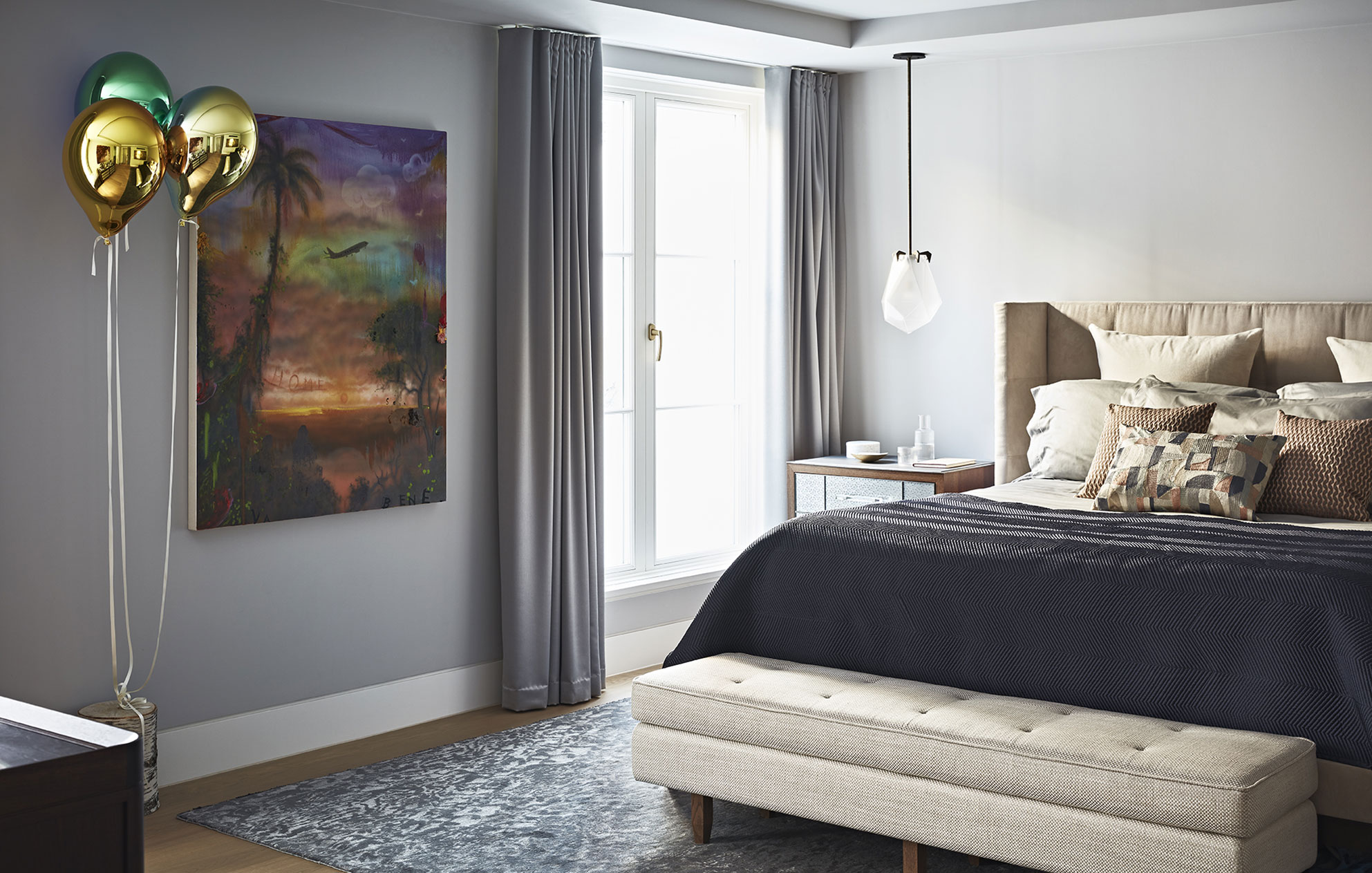 Bespoke interior design by Godrich for a Notting Hill mews house with unique artwork, luxury soft furnishings and a bed with a bedside table.