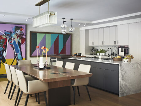 Luxury kitchen and dining room interior design in Notting Hill West London with a marble kitchen counter and colourful artworks on the wall
